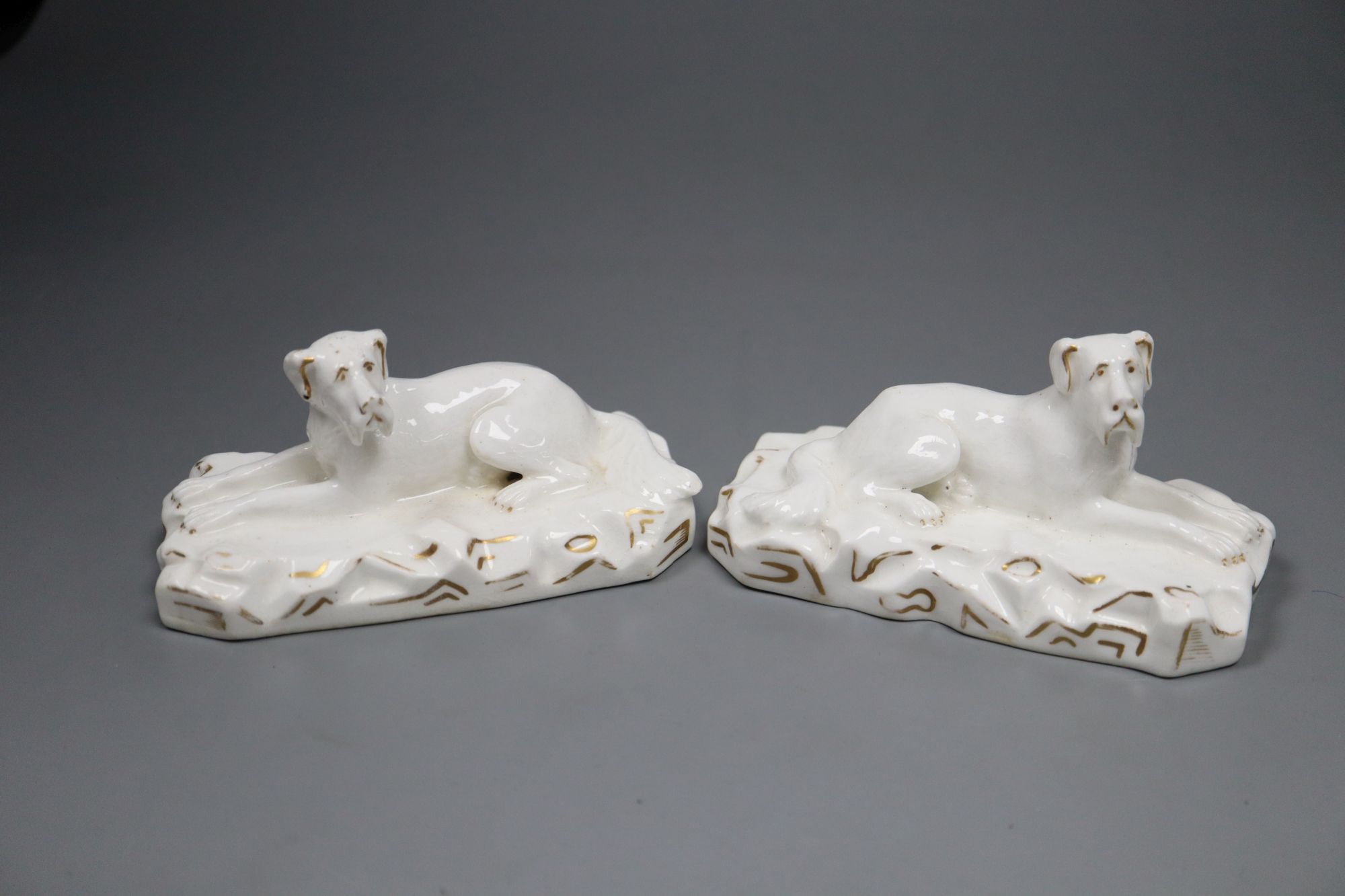 A pair of Grainger, Lee & Co. Worcester porcelain models of recumbent Great Danes, c.1820-37, 12.2cm long